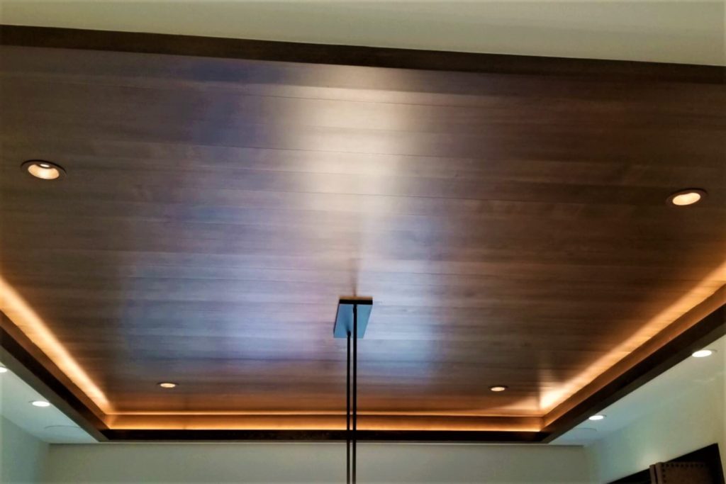 Beautiful recessed ceiling with wood panel finish